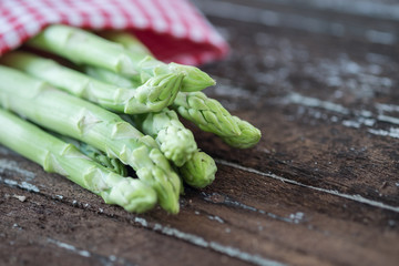 Asparagus on dark wood table
