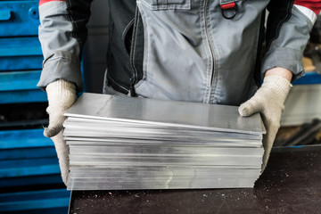 small stack of steel plates on the bench miller, hand in working