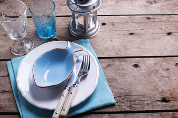  Decorative plate in form of fish, knife and fork on white plate
