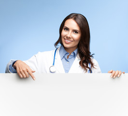 doctor showing blank signboard with copyspace