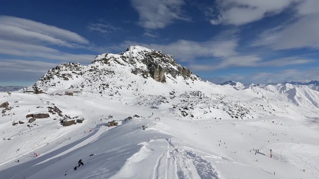 Alpine skiing tracks. Morning winter Silvretta Alps view (Tyrol, Austria). All skiers are unrecognizable.

