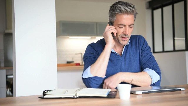 Man working from home-office with laptop computer