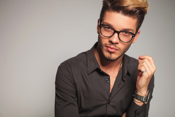 smiling young man with glasses