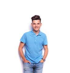 boy in polo shirt posing with hands in pockets