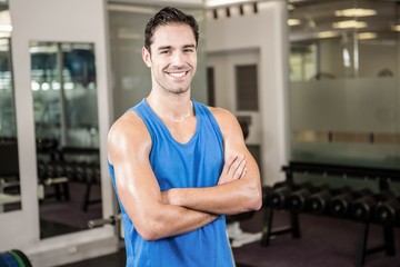 Handsome man with arms crossed looking at camera