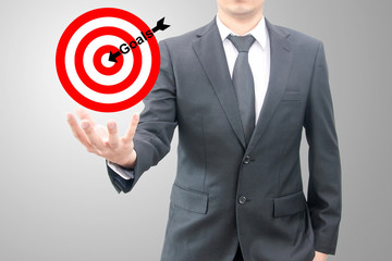 Businessman hold goals to the target business concept