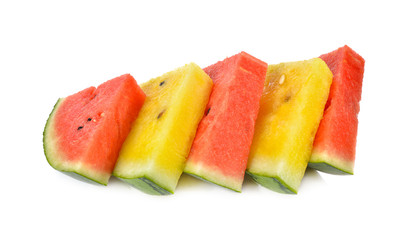 sliced red and yellow watermelon on white background