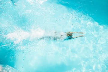 Woman diving in the pool