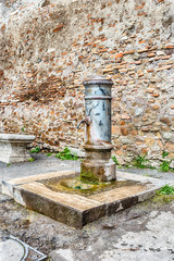 Traditional free water public fountain in Rome, Italy
