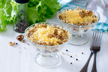 Festive salad with meat, prunes and walnuts