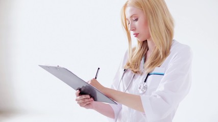 female doctor making a prescription - Powered by Adobe