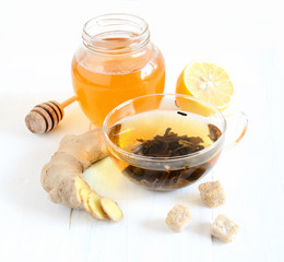 Green tea, ginger, sugar, honey lemon on a white background
