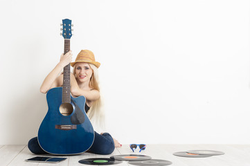Blonde woman portrait with guitar