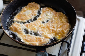 Chicken fillet fried in a pan 