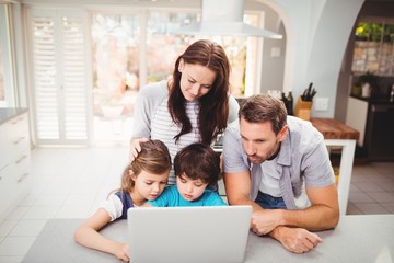 Family working on laptop 