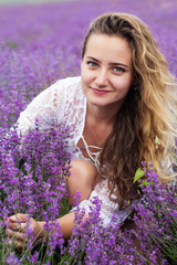 Closeup portrait of girl at purple lavender field