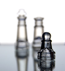 Several glass chess pieces