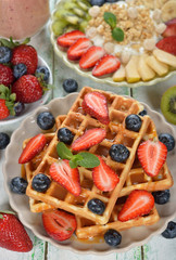 Waffles with berries and caramel sauce