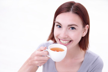 woman holding cup of  tea