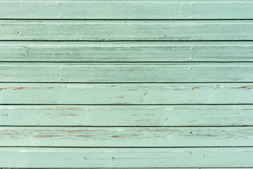Section of pale green wood panelling from a seaside beach hut. Could be used as a background to...