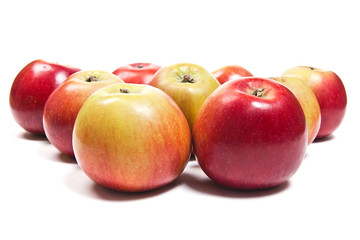Group of ripe apples on a white background
