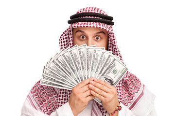 Arab hiding behind a stack of money