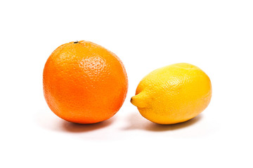 Ripe orange and lemon isolated on white.