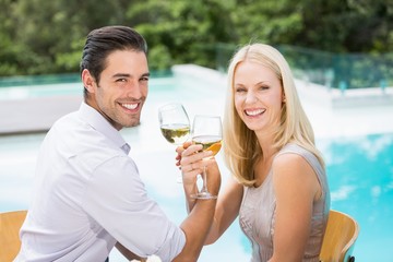 Portrait of smiling couple drinking wine 