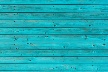 Fotobehang Section of textured turquoise wood panelling from a seaside beach hut. Could be used as a background to illustrate beach and summer holiday themes.   © kernowpjm