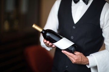 Waiter presenting red wine
