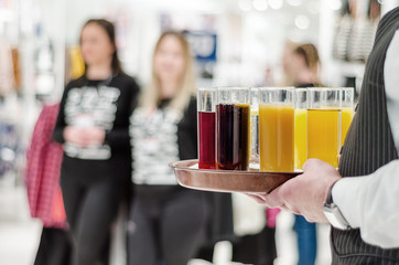 Waiter offers juice and drink at the opening ceremony