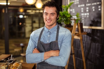 Portrait of a barista with arms crossed