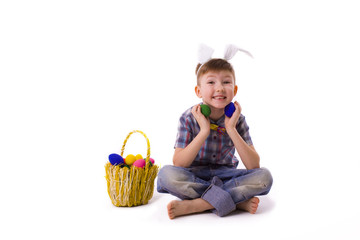 cute young boy in an image of an Easter bunny with eggs