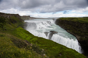 Waterfall with cloudy sky