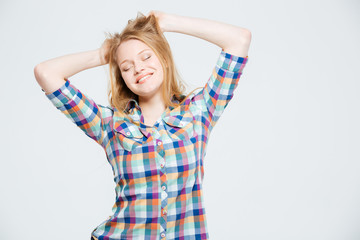 Fototapeta premium Smiling young woman with closed eyes