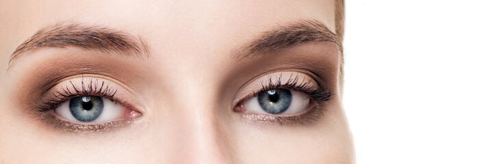 Closeup shot of woman eye with day makeup. Long eyelashes