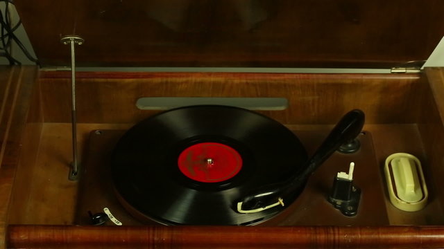 Vintage record player plays vinyl