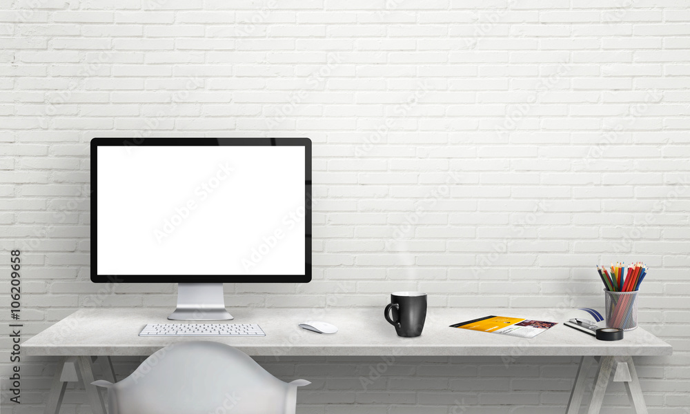Poster Isolated computer display for mockup in office interior. Work desk with keyboard, mouse, cup of coffee, paper, pencils. Free space on wall for text.