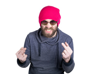 Naklejka premium Handsome young bearded hipster in pink knitted hat expresses various emotions and shows different signs the fingers. isolated on white background