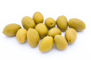 Olives on leaves isolated on white.