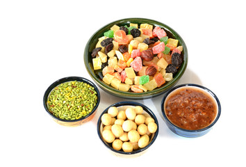 Various delicious ingredients for breakfast. Jam, nuts, dried fruits. Isolated on white background