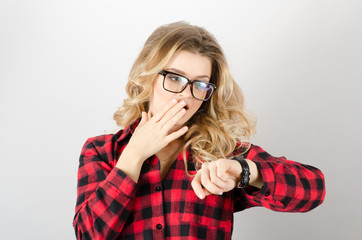 Woman looking at wrist watch, late