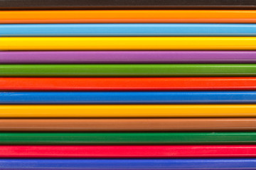 Several wooden colored pencils in a row for background