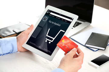 Man shopping online with digital tablet