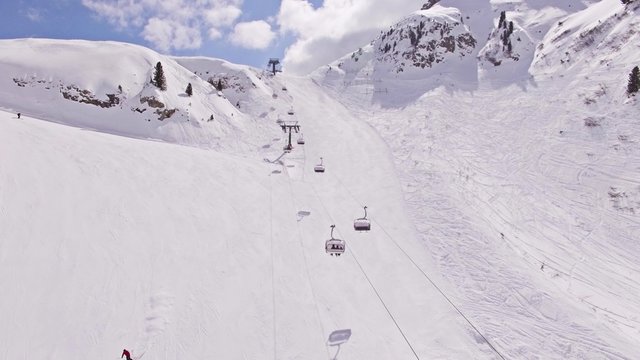 Aerial of a chair lift in Italian Alps. This is a 4k footage.