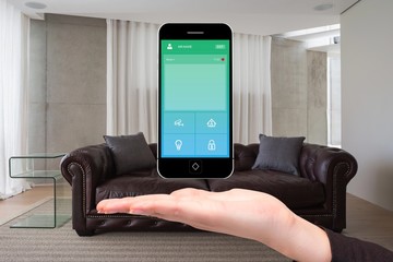 Hand showing home automation on phone