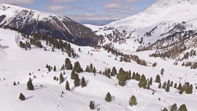 Winter aerial of a ski resort in Italian Alps. 4k footage.