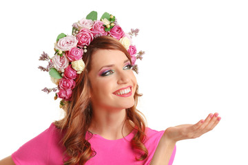 Beautiful young woman wearing floral headband isolated on white background