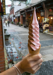 The delicious long Ice-cream cone (mixed strawberry and chocolate flavor) at food street market in Taipei, Taiwan.