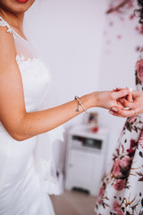 beautiful gorgeous stylish bride brunete getting ready in the morning in the room